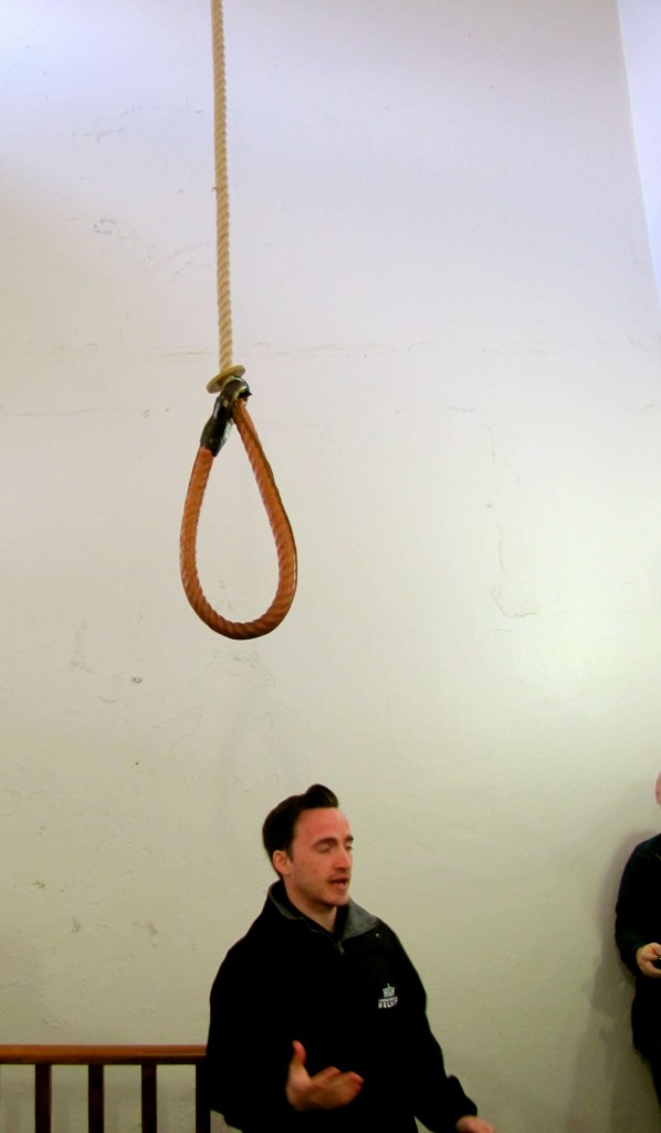 The noose hanging above the (glassed-over) trap door.