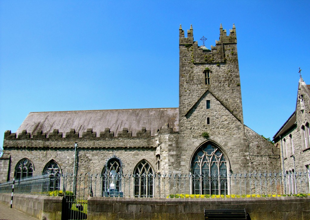 This is the Black Abbey. It was seized from the Church by Henry VIII, sacked and used to stable horses by Oliver Cromwell, and generally abused and neglected for years. When it was rebuilt, only about half the stone could be recovered, so it is built in an L shape rather than the usual cross.