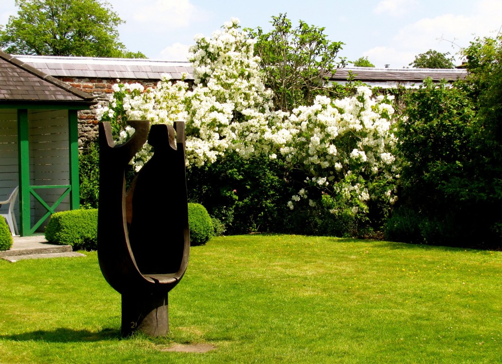 ... past the sculpture and through a little gate in the wall...