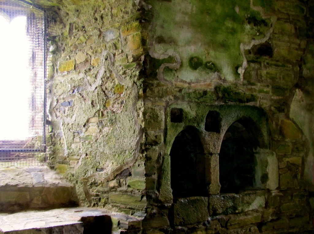 The little cubbyhole in the chapel wall had a little depression in it that filled with rainwater from the water collection system of the castle. The water would be blessed, and any leftover would be let out a drain in the bottom to return to the earth.