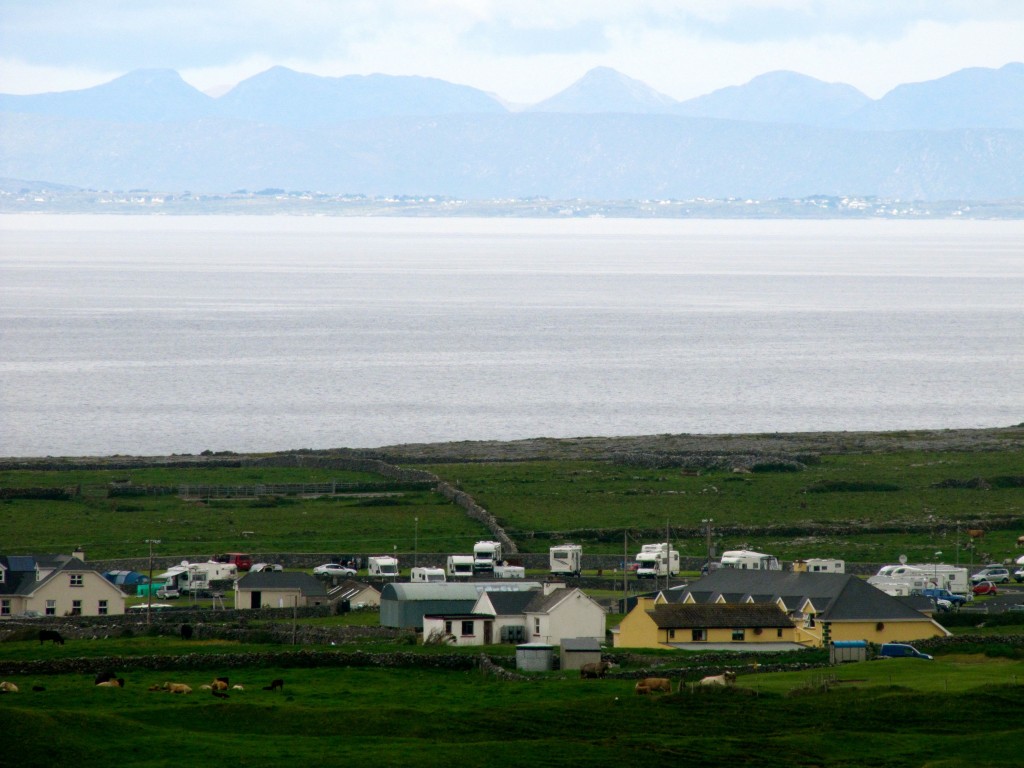 Looking down at Doolin and across Galway Bay at the Connemara coastline.