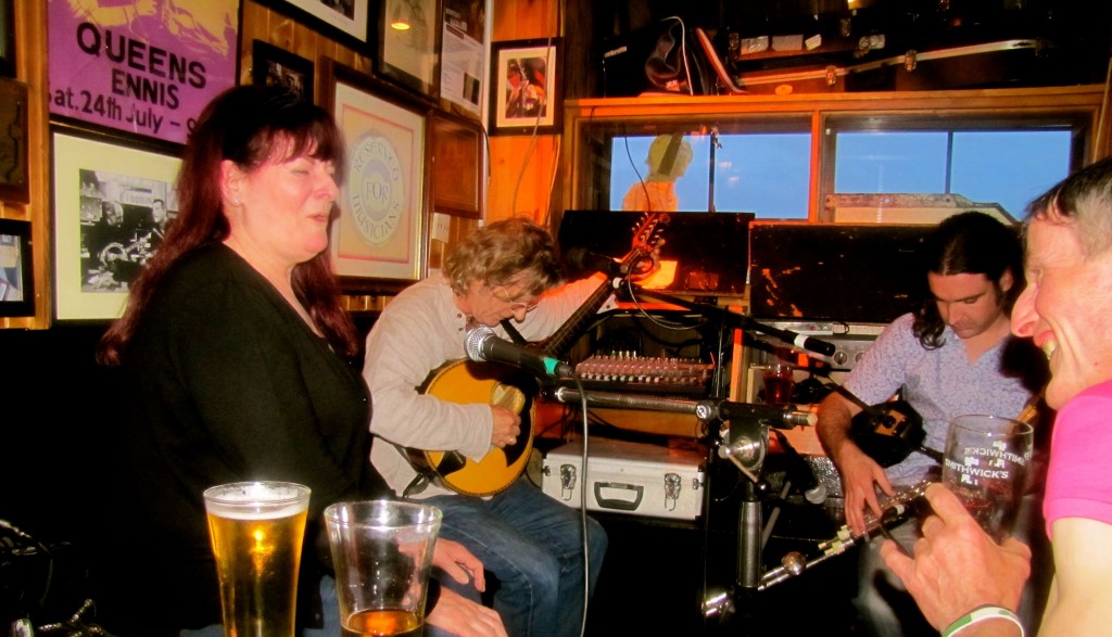 Yeah. That's how close I'm sitting. The singer is putting her beer on my table. Oh, and the singer? Geraldine MacGowan, formerly of the band Oisin. The piper is Blackie O'Connell, said by locals to be the best piper in Ireland. I didn't catch the name of the guy in the middle, but he's playing a mandola, so you know he's badass. And leaning into the picture from the right is Johnny from Mulingar, the harmonica player from last night, whom I think might be mad, but in a friendly, welcoming, happy way.