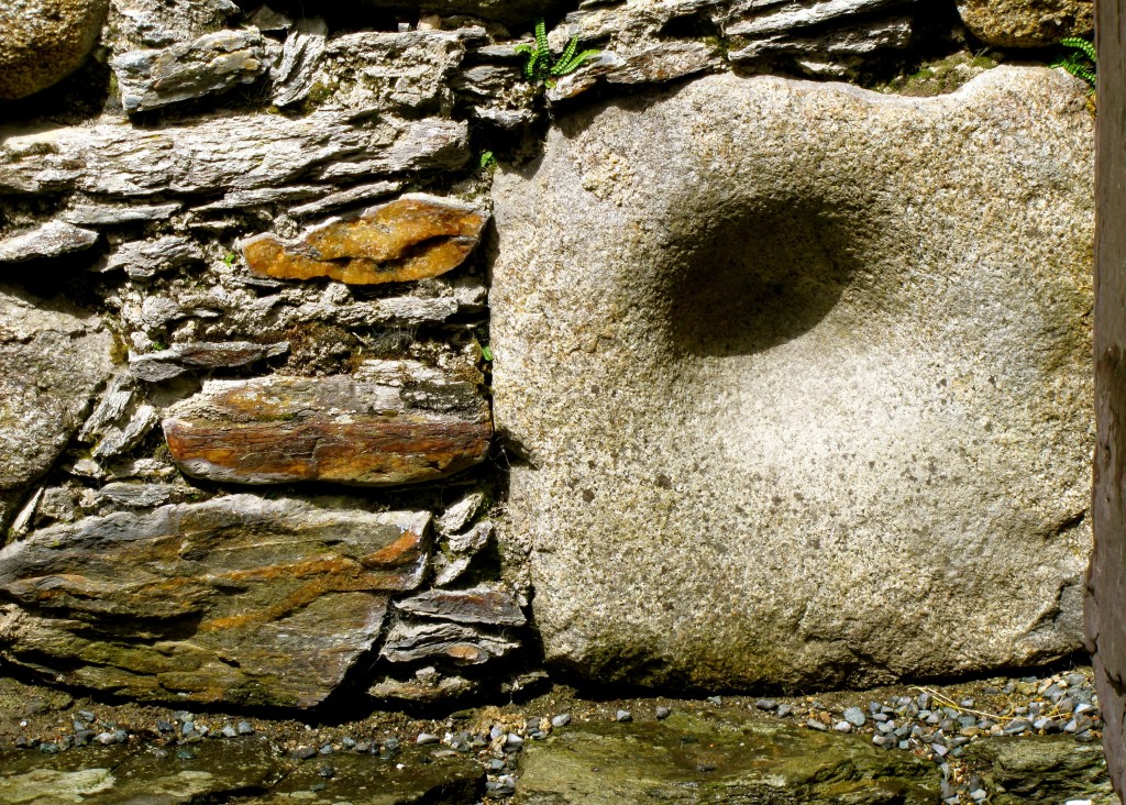 This stone was probably used as a mortar by the pre-Christians who lived in this area before the arrival of St. Kevin. Such a stone would be used primarily for grinding herbs for medicine by the holy men/women of the clan. It was taken to be the cornerstone of the new church here.