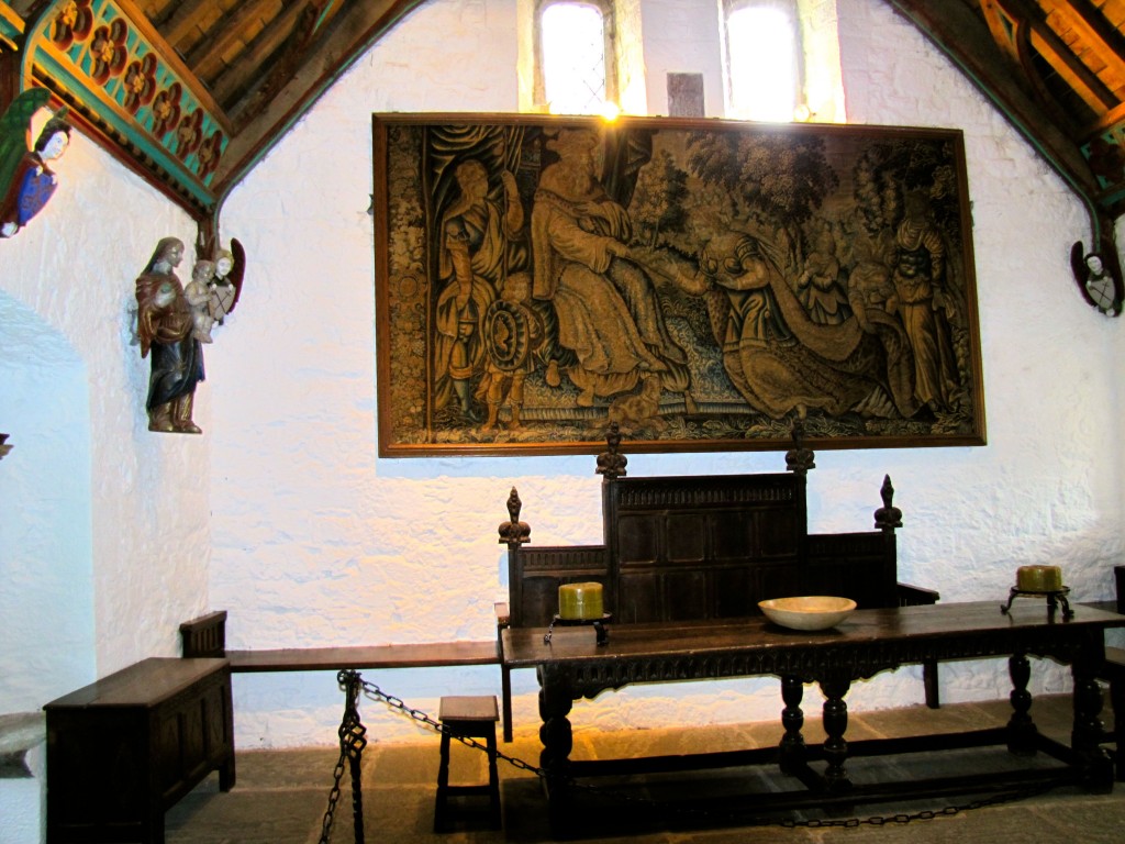 The high table, with a nice tapestry hanging behind it.