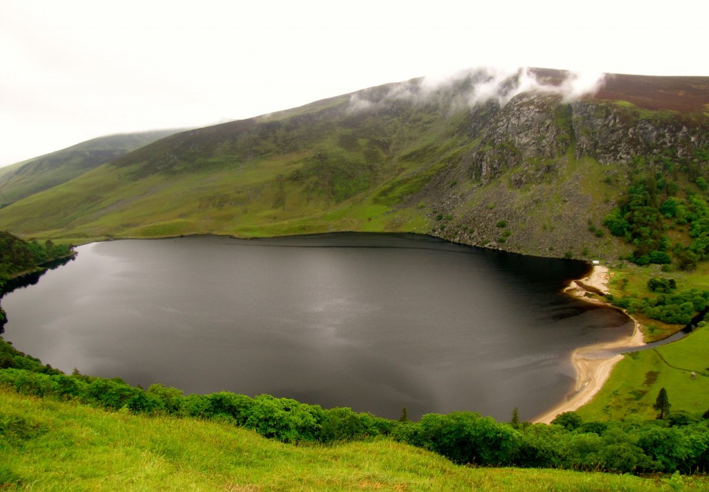 Lough Tay is owned by the Guinness family. As a wedding present for one of the women marrying into the family, they bought an estate at the edge of this lough, and imported sand to make the dark lough water look like a pint of Guinness with a head.
