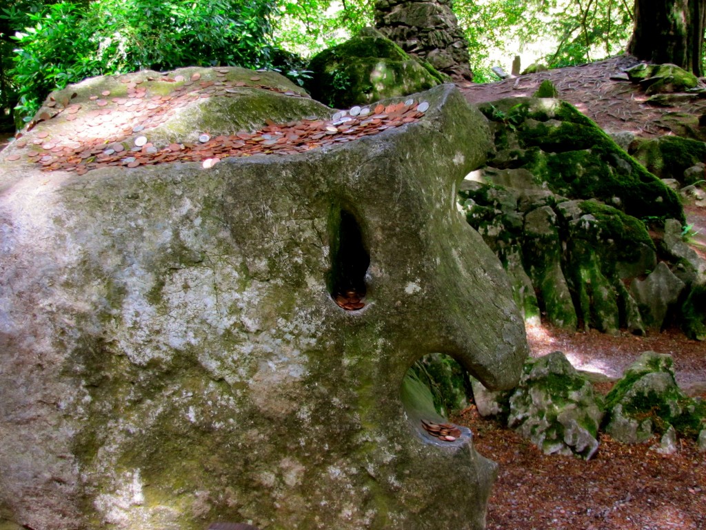 People have started leaving coins on the Witch's Stone. Last time I was here, there was just a red berry in her mouth.