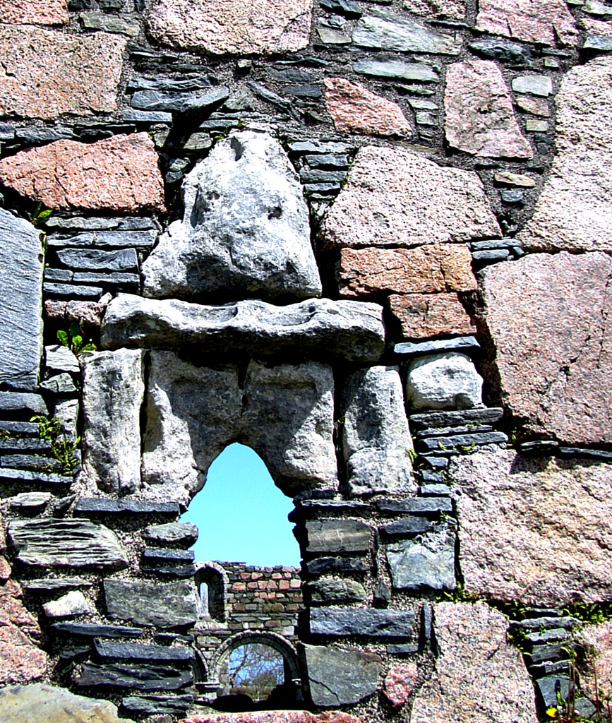 This is an interesting carving. It's pretty worn, and I've done some fiddling with contrast and stuff to make it show up clearly. It's a sheela-na-gig, a carving of a woman with her legs spread. It's supposed to chase away evil spirits. The origins of this belief and motif are unclear, but they're fairly common in Scotland, Ireland, and England on churches from the 13th and 14th centuries.