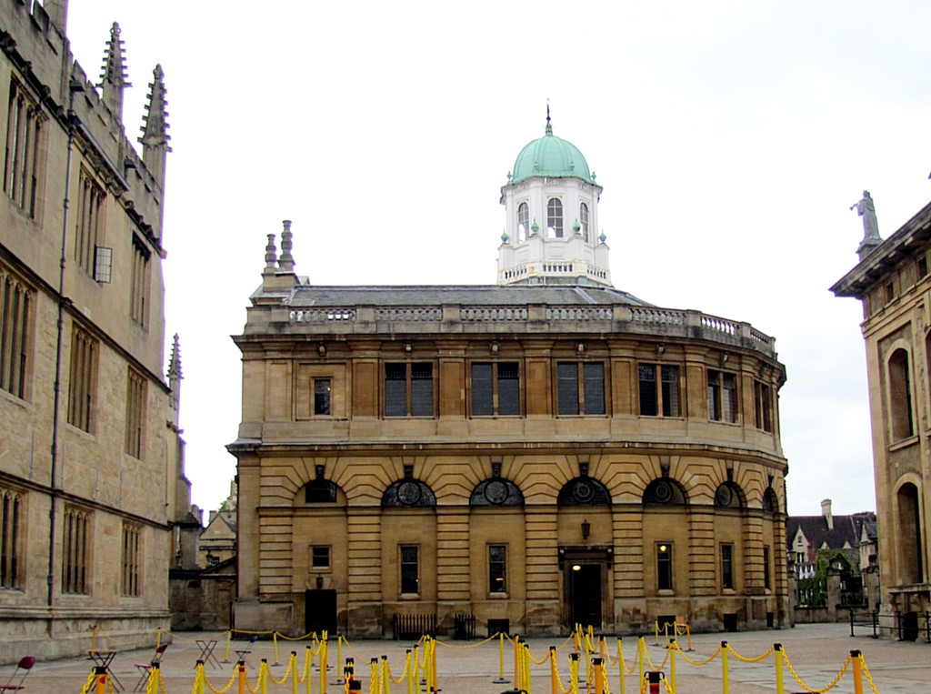 This is a side view of the Sheldonian Theatre. It's where most of the big ceremonies - like graduations - are held. You can see the rope lines set up to keep the students in line. It was designed by Christopher Wren while he was studying Astronomy at Oxford, and is apparently a masterpiece of criss-crossing beams supporting the ceiling, rather than using columns.