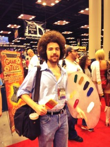 Bob Ross, from The Joy of Painting. This costume thrilled me so much that I called Scott over to see it. Right in front of a very attractive, scantily clad woman who turned out to be a professional cosplayer. I felt that I had been very rude, afterwards, and I'm sorry about that. But still - Bob Ross cosplay! Right?